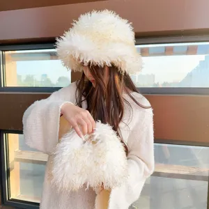Detailed view of the fuzzy faux sheepskin bucket hat and matching plush handbag set