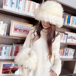 Gradient faux sheep fur bucket hat and matching handbag set worn in lifestyle setting