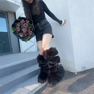 Y2K punk style platform boots in black faux fur with buckle and stud details