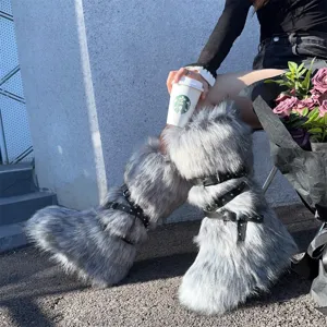 Detail view of grey faux fur platform boots with punk buckle straps and studs