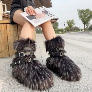 Close-up detail of Y2K style faux fur snow boots with punk buckle straps and silver rivets