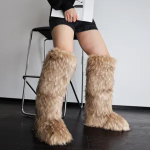 Model wearing stylish tan faux fur knee-high snow boots in a Y2K aesthetic.