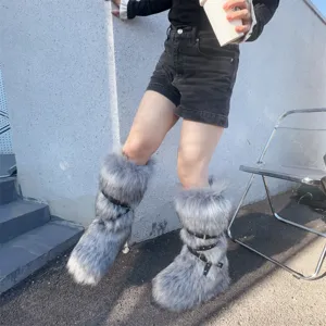 Close-up detail of Y2K grey faux fur platform snow boots with punk style rivet straps