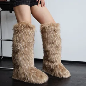 Detailed view of knee-high faux fur boots featuring brown spotted texture and Y2K style.