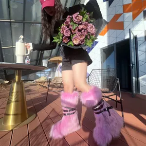 Close-up of pink faux fur Y2K punk boots with buckle straps on a model