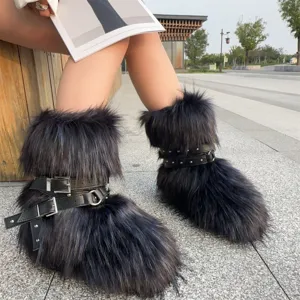 Detailed view of Y2K punk style black faux fur snow boots with decorative buckles