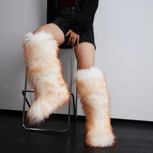 High detail view of Y2K style warm white and orange faux fur knee high snow boots