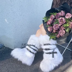Close-up of stylish white faux fur Y2K platform boots with black buckled straps and rivets.