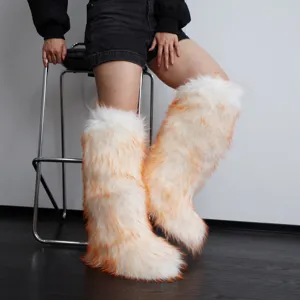 White and orange gradient faux fox fur knee-high snow boots in Y2K style detail
