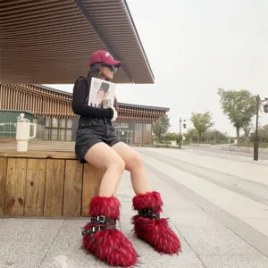Trendy red faux fur platform boots with punk buckle straps in a Y2K street style look