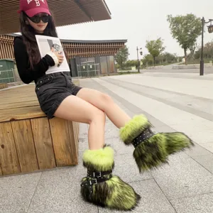 Outdoor style shot of neon green faux fur snow boots with chunky platform and buckles