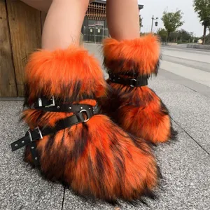 Close-up of orange faux fur Y2K punk boots with black leather buckles and rivets