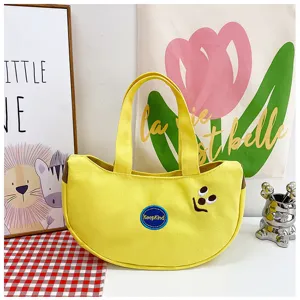 Gelbe Handtasche in Bananenform aus Canvas mit Cartoon-Stickerei und KeepKind-Abzeichen