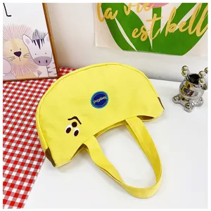 Süße Handtasche aus Segeltuch in Bananenform mit Cartoon-Stickerei und stabilen Griffen.