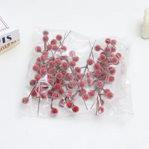 Frosted artificial red berry stems for Christmas and New Year home floral arrangement decor.