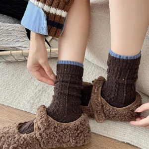 Women thick warm mid-tube wool socks with speckled yarn design, cozy winter Maillard style footwear.