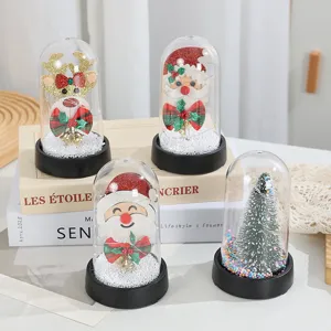 Dettaglio della lampada notturna di Natale sotto cupola di vetro con Babbo Natale.