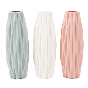 Modern geometric plastic flower vases set of three colors for home decor and floral arrangements.