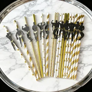 Paper straws with bodybuilder silhouette decorations, detail shot of party drink straws.