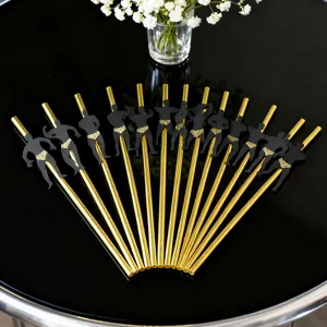 Gold paper drinking straws with muscular man cutout decorations for party events.