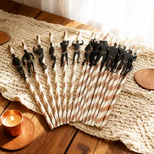 Decorative paper straws with muscular man silhouettes, creative party drink accessories.
