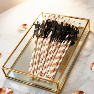 Disposable paper straws with creative muscular bodybuilder silhouette toppers for party decor.