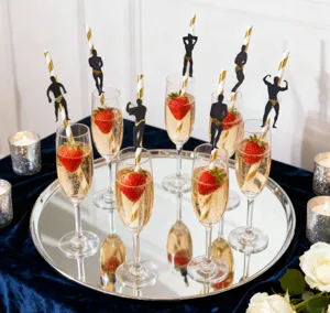 Creative bachelorette party paper straws with muscular man silhouette toppers for fun events.
