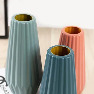 Plastic flower vase set, modern geometric ribbed design with gold rim for home decor.