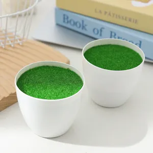 Minimalist white plastic moss flower pot artificial greenery vase for home tabletop decor.