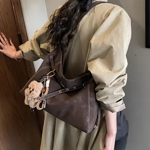 Retro frosted shoulder tote bag for women, large capacity stylish underarm bag with charm.
