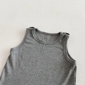Close-up detail of grey ribbed baby tank top, soft knit fabric texture, comfortable infant wear.