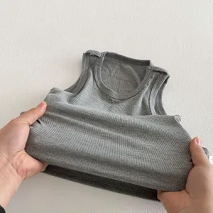 Grey ribbed baby tank top detail, soft cotton knit fabric, comfortable infant sleeveless vest.