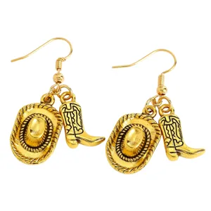 Detailed view of gold-tone Western cowboy hat and boot charm earrings on white background