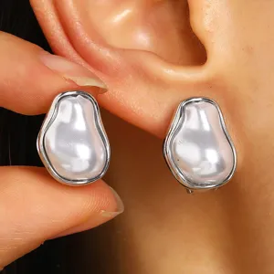 Eleganti orecchini di perle barocche vintage con montatura in argento irregolare