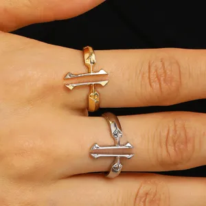Close-up view of elegant gold and silver double cross open rings on fingers for women