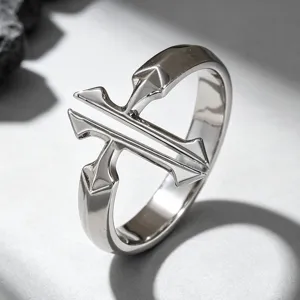 Close-up detail of a minimalist silver-toned double cross ring with a polished finish