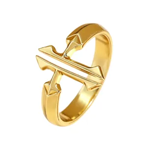 Detailed macro view of a minimalist gold-plated double cross open ring for women