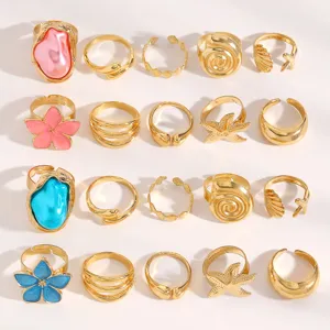Detailed macro view of vintage Baroque gold ring set with colorful flowers and pearls