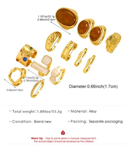 Detail view of vintage gold alloy ring set with baroque pearls and amber-like stones.