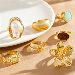 Detailed view of a vintage gold-plated ring set with baroque pearl and flower