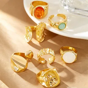 Macro view of a gold vintage rings set featuring lava texture and various colored stones