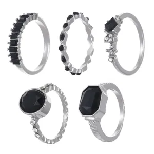 Detailed view of a 5-piece retro silver ring set featuring faceted black stones.
