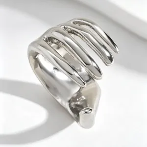 Close-up of silver punk skeleton hand ear bone cuff for non-pierced ears and fashion style