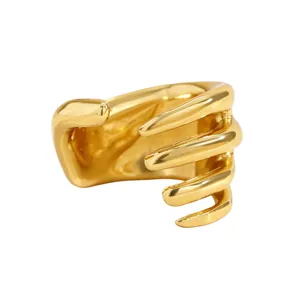 Detailed view of punk style skeletal hand ear cuff in polished gold finish for non-pierced ears