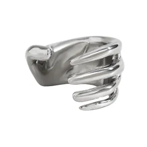 Punk style silver metallic skeleton hand ear cuff with wrap-around bone design detail