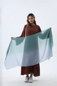 Elegant gradient chiffon hijab shawl featuring a smooth teal to light blue color transition