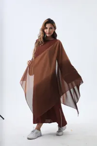 Full-body shot of professional model wearing an elegant brown chiffon shawl dress set