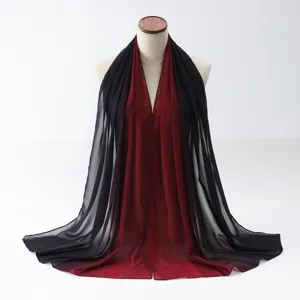 Elegant red and black gradient chiffon scarf shawl draped on a mannequin detail view