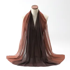 Elegant gradient brown chiffon scarf elegantly draped on a mannequin for fashion display