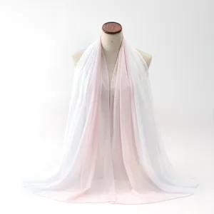 Elegant light pink and white gradient chiffon scarf for women shown on a mannequin